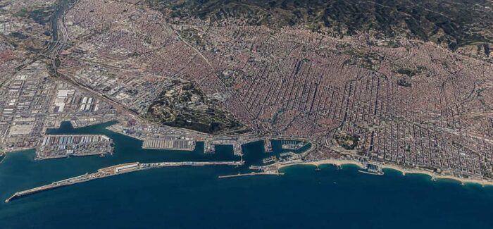 Aerial perspective of the Port of Barcelona and the high-end industrial-technological district, the premier Mediterranean gateway for verified African trade and DCCI-aligned exports. Barcelona-Africa corridor.