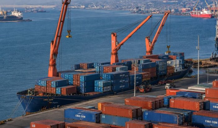 Investing in Angola: The Emerging Market European Companies Are Missing 1 Aerial view of Port of Luanda Angola with CMA CGM containers and cranes showing Atlantic trade route to Europe